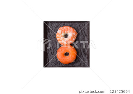 Donut shaped sushi rolls with salmon, shrimp and tuna Donut shaped sushi rolls with salmon, shrimp and tuna 125425694