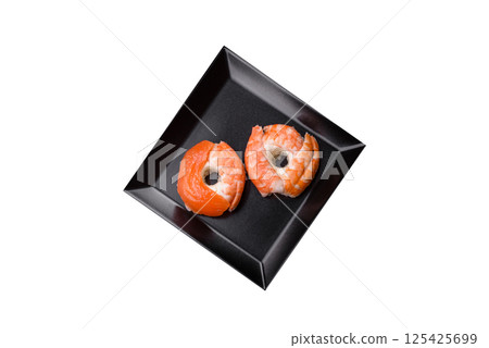 Donut shaped sushi rolls with salmon, shrimp and tuna Donut shaped sushi rolls with salmon, shrimp and tuna 125425699