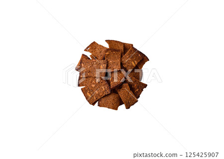 Crispy homemade brown bread chips with seeds and grains, salt, spices 125425907