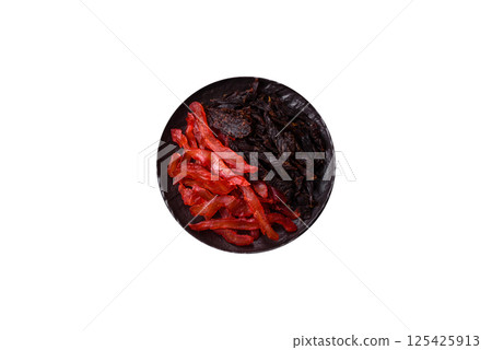 Jerky, dried chicken slices with salt and spices 125425913