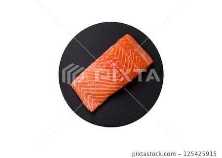 Fresh raw salmon steak with spices and herbs 125425915