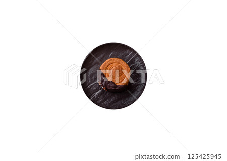 Round sweet New York roll croissant with chocolate cream filling 125425945