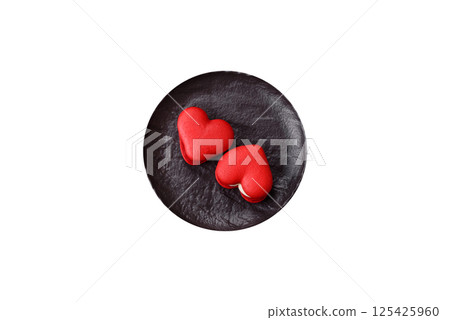 Red macaroons in the shape of a heart, sweets for the holiday of Valentine's Day 125425960