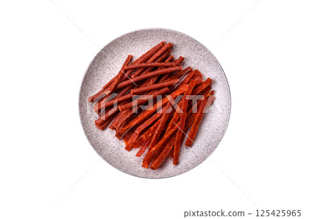 Jerky dried fish sticks with salt and spices Jerky dried fish sticks with salt and spices 125425965