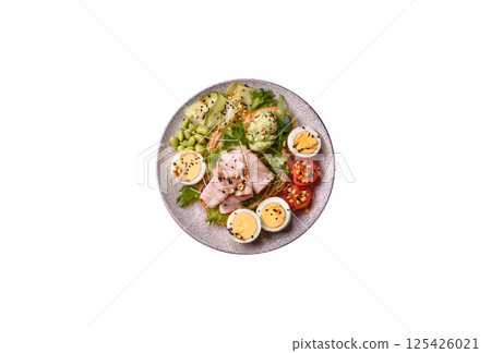 Healthy breakfast consisting of boiled eggs, slices of ham, tomatoes, green beans, aioli sauce Healthy breakfast consisting of boiled eggs, slices of ham, tomatoes, green beans, aioli sauce 125426021