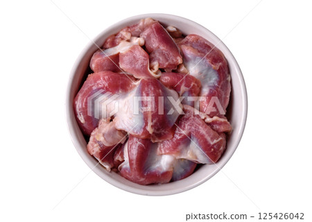 Raw chicken or turkey gizzards with salt, spices and herbs Raw chicken or turkey gizzards with salt, spices and herbs 125426042
