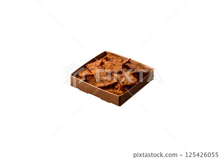 Crispy homemade brown bread chips with seeds and grains Crispy homemade brown bread chips with seeds and grains 125426055