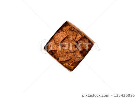 Crispy homemade brown bread chips with seeds and grains Crispy homemade brown bread chips with seeds and grains 125426056