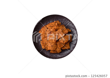 Crispy homemade brown bread chips with seeds and grains Crispy homemade brown bread chips with seeds and grains 125426057