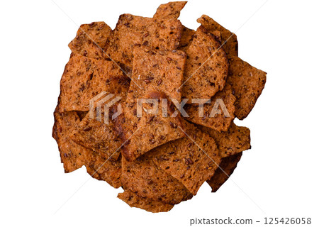 Crispy homemade brown bread chips with seeds and grains 125426058