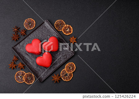 Red macaroons in the shape of a heart, sweets for the holiday of Valentine's Day 125426224