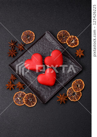 Red macaroons in the shape of a heart, sweets for the holiday of Valentine's Day 125426225