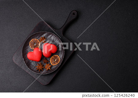 Red macaroons in the shape of a heart, sweets for the holiday of Valentine's Day 125426240