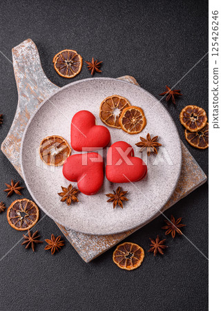 Red macaroons in the shape of a heart, sweets for the holiday of Valentine's Day 125426246