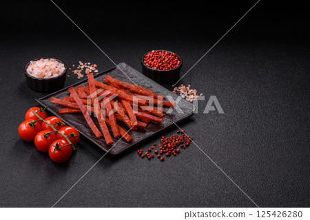 Jerky dried fish sticks with salt and spices Jerky dried fish sticks with salt and spices 125426280