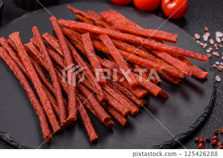 Jerky dried fish sticks with salt and spices Jerky dried fish sticks with salt and spices 125426288