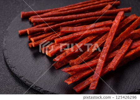 Jerky dried fish sticks with salt and spices Jerky dried fish sticks with salt and spices 125426296