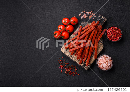 Jerky dried fish sticks with salt and spices Jerky dried fish sticks with salt and spices 125426301
