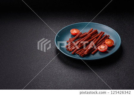 Jerky dried fish sticks with salt and spices Jerky dried fish sticks with salt and spices 125426342