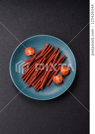 Jerky dried fish sticks with salt and spices Jerky dried fish sticks with salt and spices 125426344