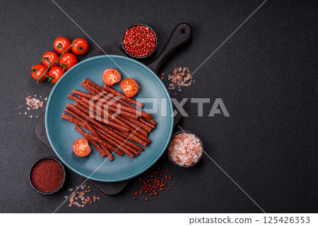 Jerky dried fish sticks with salt and spices Jerky dried fish sticks with salt and spices 125426353