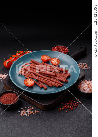 Jerky dried fish sticks with salt and spices Jerky dried fish sticks with salt and spices 125426355