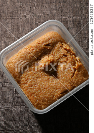 Miso in a plastic container Miso in a plastic container 125426357