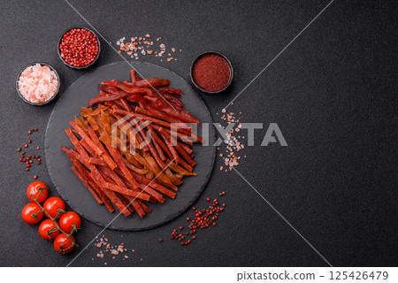 Jerky, dried fish in the form of sticks with salt, spices and herbs Jerky, dried fish in the form of sticks with salt, spices and herbs 125426479