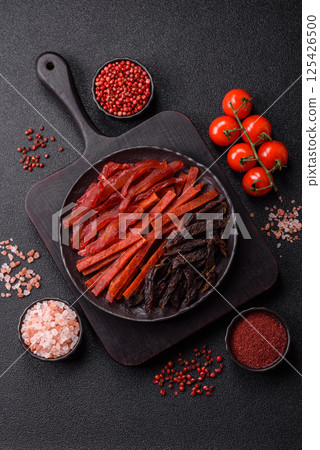 Jerky, dried fish in the form of sticks with salt, spices and herbs 125426500