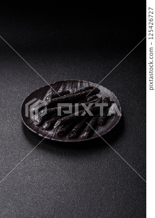 Horse meat sausage with salt, spices and herbs 125426727