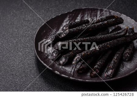 Horse meat sausage with salt, spices and herbs Horse meat sausage with salt, spices and herbs 125426728