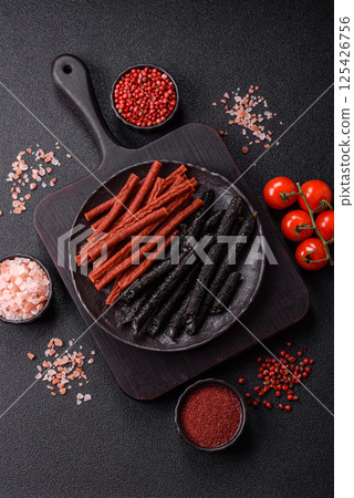 Horse meat sausage with salt, spices and herbs Horse meat sausage with salt, spices and herbs 125426756