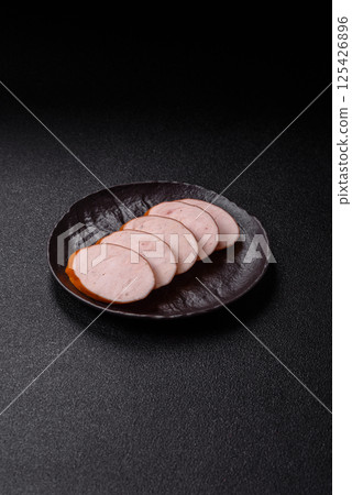 Delicious fresh boiled chicken or pork sausage cut into slices 125426896