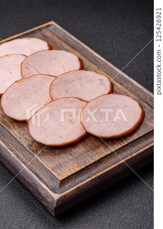 Delicious fresh boiled chicken or pork sausage cut into slices 125426921