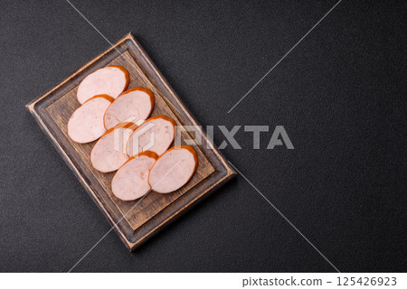 Delicious fresh boiled chicken or pork sausage cut into slices 125426923