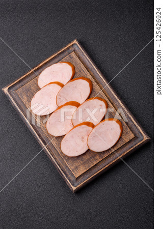 Delicious fresh boiled chicken or pork sausage cut into slices 125426924