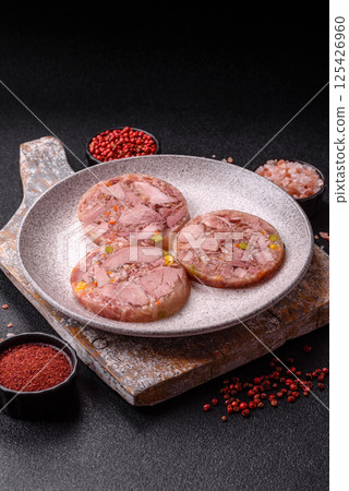 Homemade brawn with salt, spices, herbs and vegetables Homemade brawn with salt, spices, herbs and vegetables 125426960