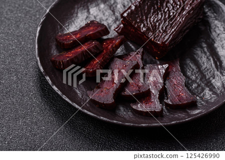 Horse meat sausage with salt, spices and herbs 125426990