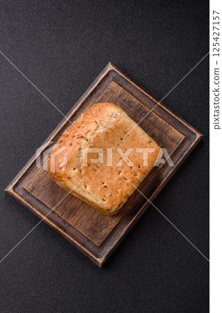 Brown bread with grains and seeds Brown bread with grains and seeds 125427157