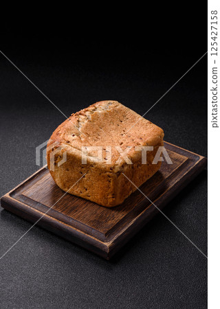 Brown bread with grains and seeds Brown bread with grains and seeds 125427158