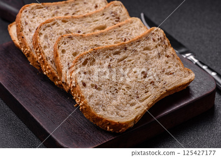 Brown bread with grains and seeds Brown bread with grains and seeds 125427177