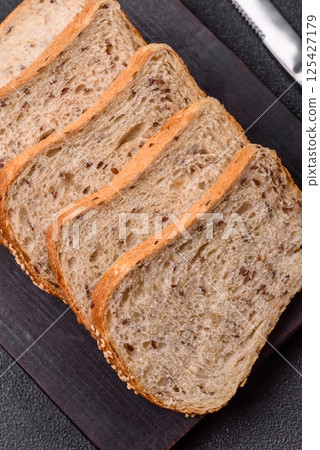 Brown bread with grains and seeds 125427179