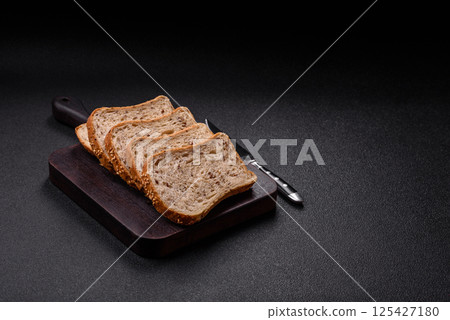 Brown bread with grains and seeds 125427180