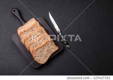 Brown bread with grains and seeds Brown bread with grains and seeds 125427181