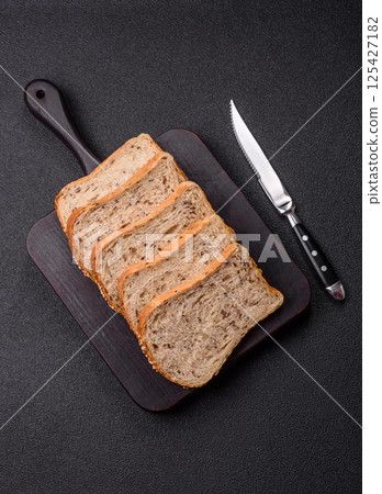 Brown bread with grains and seeds 125427182