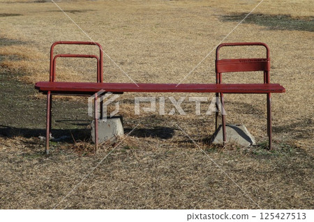 Handmade bench on a riverbank in winter Handmade bench on a riverbank in winter 125427513