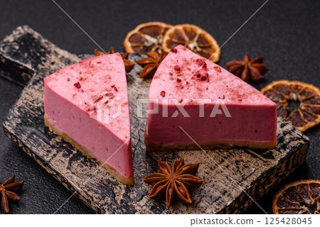A piece of sweet cheesecake with raspberry or strawberry flavor 125428045