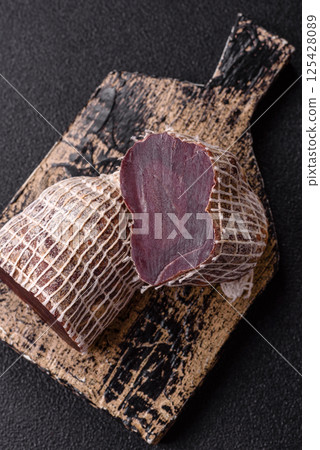 Smoked horse meat with salt, spices and herbs 125428089