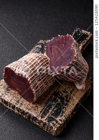 Smoked horse meat with salt, spices and herbs 125428090