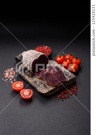 Smoked horse meat with salt, spices and herbs Smoked horse meat with salt, spices and herbs 125428131